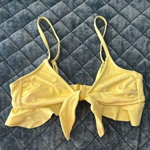 Pastel yellow swimsuit top